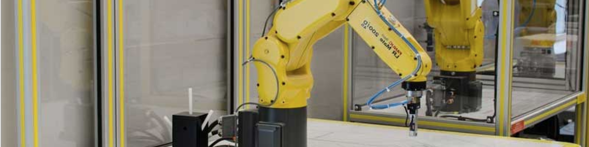 Yellow robotic arm used on assembly lines